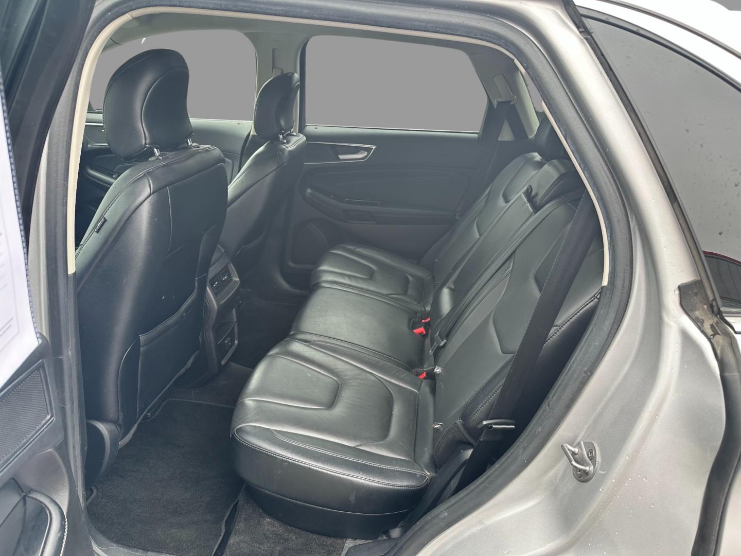2017 Silver /Black Ford Edge Titanium (2FMPK4K92HB) with an 2.0L I4 DOHC 16V Turbo engine, 6-Speed Automatic transmission, located at 547 E. Main St., Orwell, OH, 44076, (440) 437-5893, 41.535435, -80.847855 - This 2017 Ford Edge Titanium AWD is a well-equipped midsize SUV. It comes with a powerful yet efficient 2.0L EcoBoost engine paired with a smooth 6-speed automatic transmission. Notable features include LED daytime running lights, dusk-sensing headlights, leather interior, auto-dimming rearview mirr - Photo#35